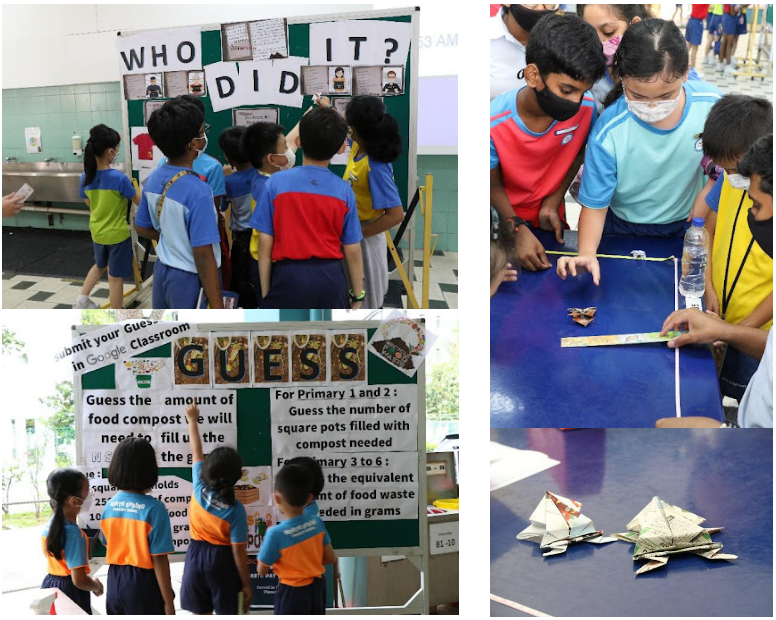 Children in school uniforms participate in activities including a guessing board, a composting display, and origami folding.